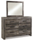 Wynnlow King Crossbuck Panel Bed with Mirrored Dresser, Chest and 2 Nightstands